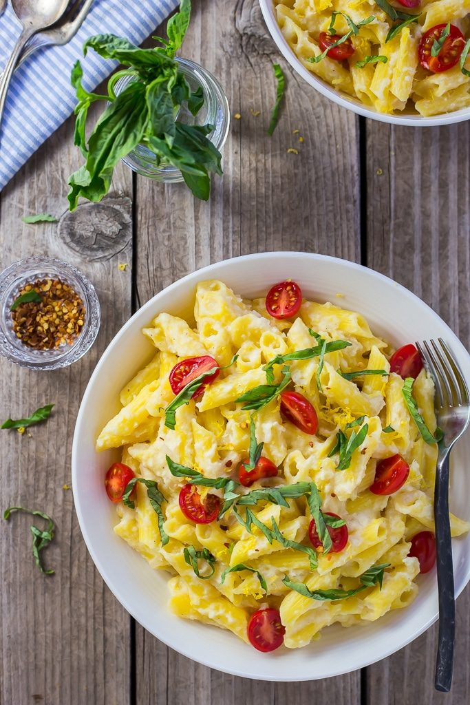Creamy Corn Penne with Basil & Cherry Tomatoes! This dish is the perfect bite of summer with sweet corn, basil and cherry tomatoes! Gluten free and vegan too!