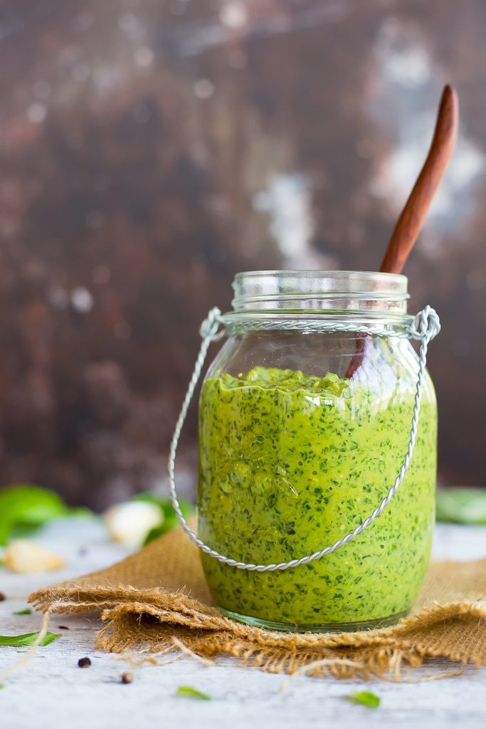Creamy Vegan Basil Pesto - Pesto is the perfect way to use up the rest of your summer basil crop before it is too late!  This pesto goes perfectly with pasta, pizza, sandwiches and much more!