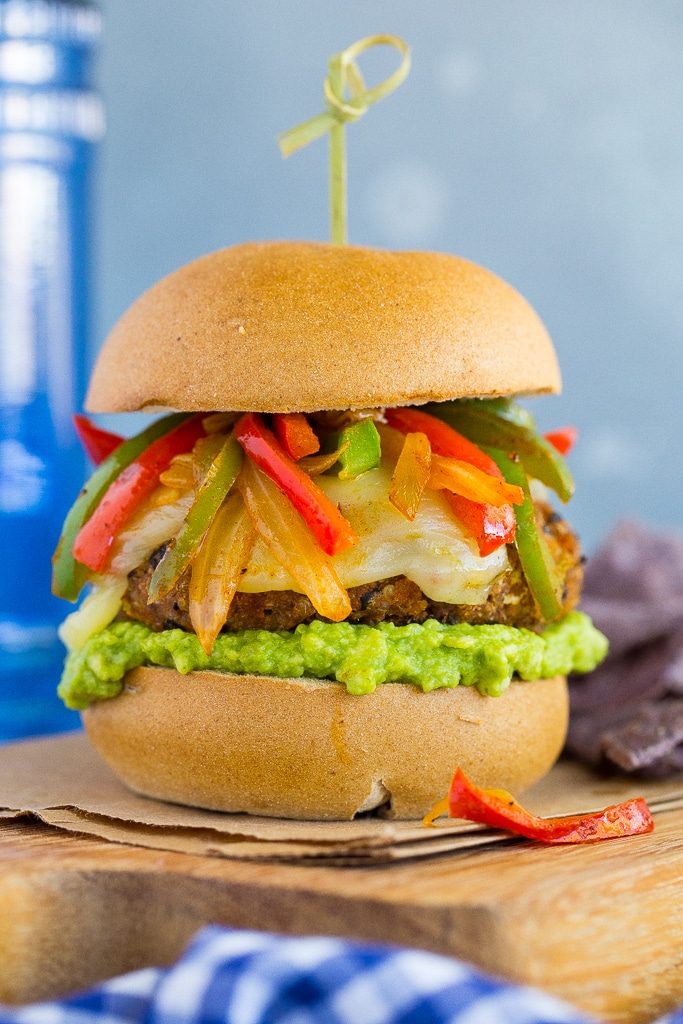 Jazz up your veggie burgers by making these Black Bean Fajita Veggie Burgers! Topped with fajita peppers and onions, pepperjack cheese and guacamole! {gluten free}