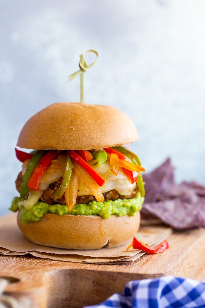 Jazz up your veggie burgers by making these Black Bean Fajita Veggie Burgers! Topped with fajita peppers and onions, pepperjack cheese and guacamole! {gluten free}
