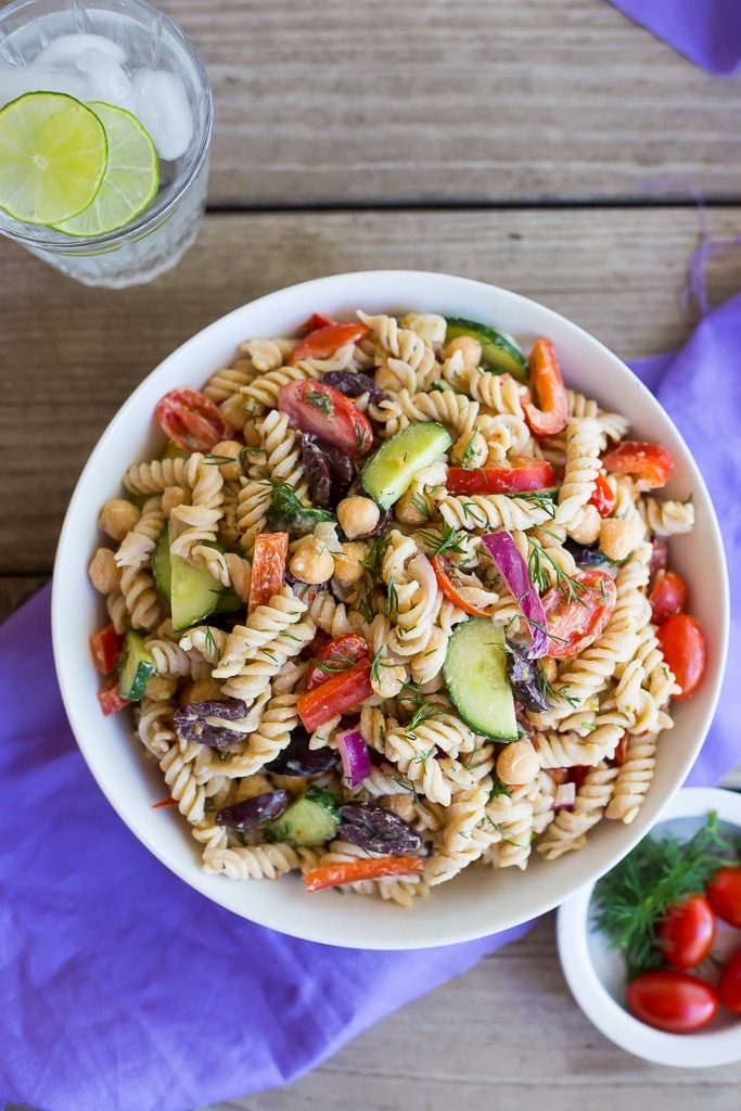 This Creamy Tahini Greek Pasta Salad is so easy to make and perfect for lunch! It's vegan, gluten free and full of delicious vegetables and creamy pasta!