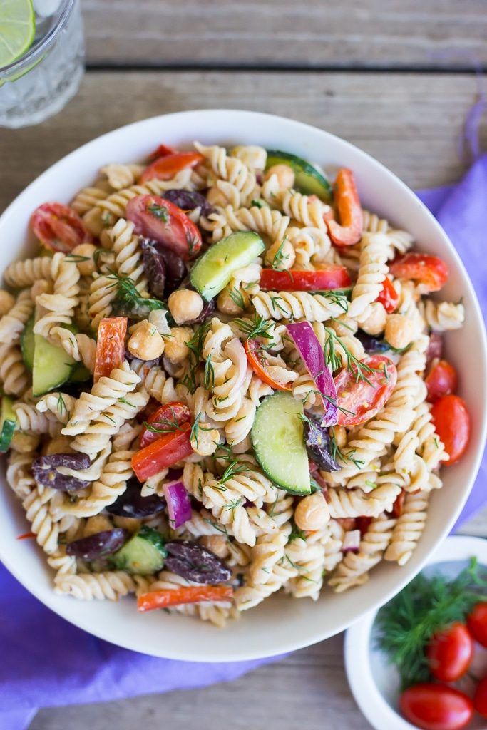 This Creamy Tahini Greek Pasta Salad is so easy to make and perfect for lunch! It's vegan, gluten free and full of delicious vegetables and creamy pasta!