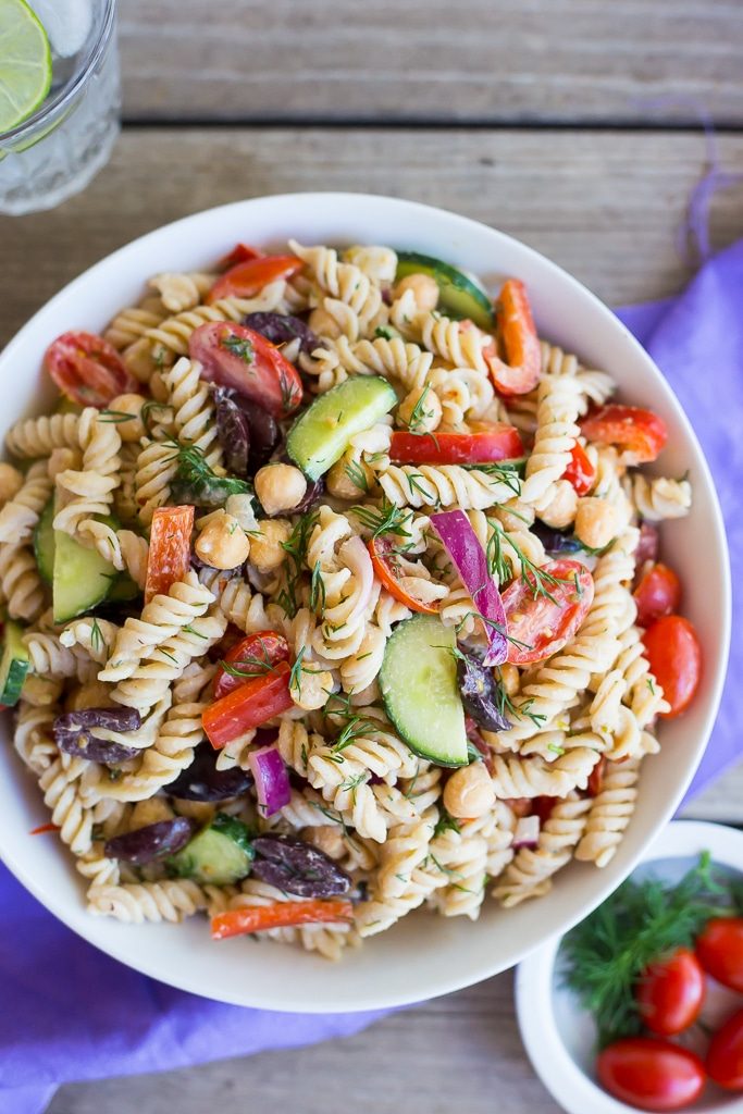 This Creamy Tahini Greek Pasta Salad is so easy to make and perfect for lunch! It's vegan, gluten free and full of delicious vegetables and creamy pasta!
