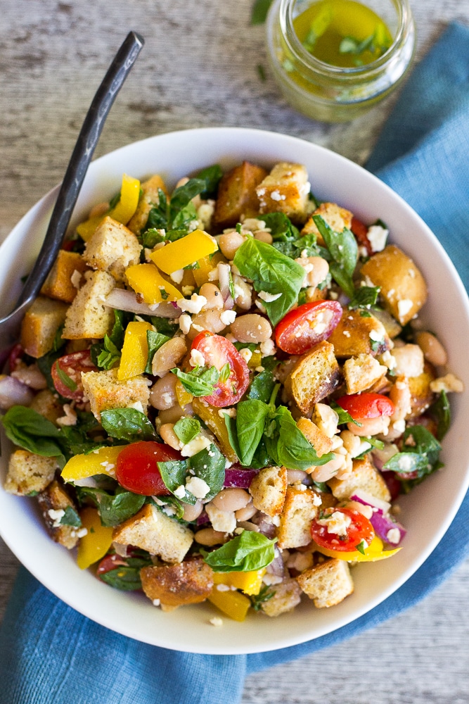 This Spinach and White Bean Panzanella Salad with Basil Vinaigrette is fresh, filling and delicious! It's the perfect meal for lunch that can also be made ahead! {gluten free}
