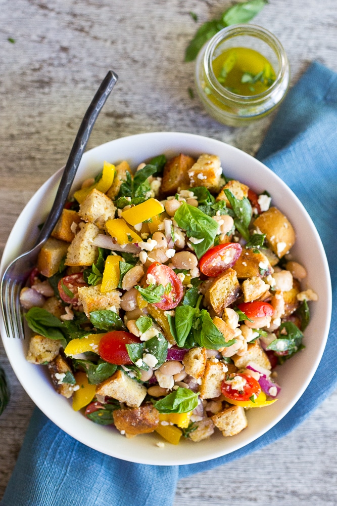 This Spinach and White Bean Panzanella Salad with Basil Vinaigrette is fresh, filling and delicious! It's the perfect meal for lunch that can also be made ahead! {gluten free}