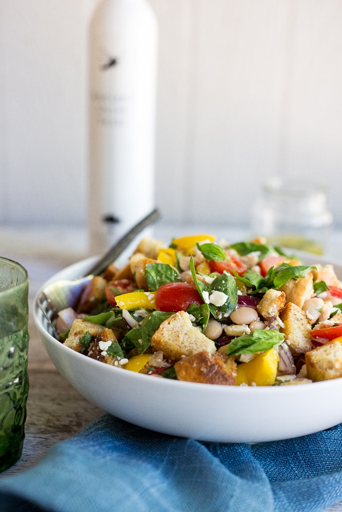 This Spinach and White Bean Panzanella Salad with Basil Vinaigrette is fresh, filling and delicious! It's the perfect meal for lunch that can also be made ahead! {gluten free}