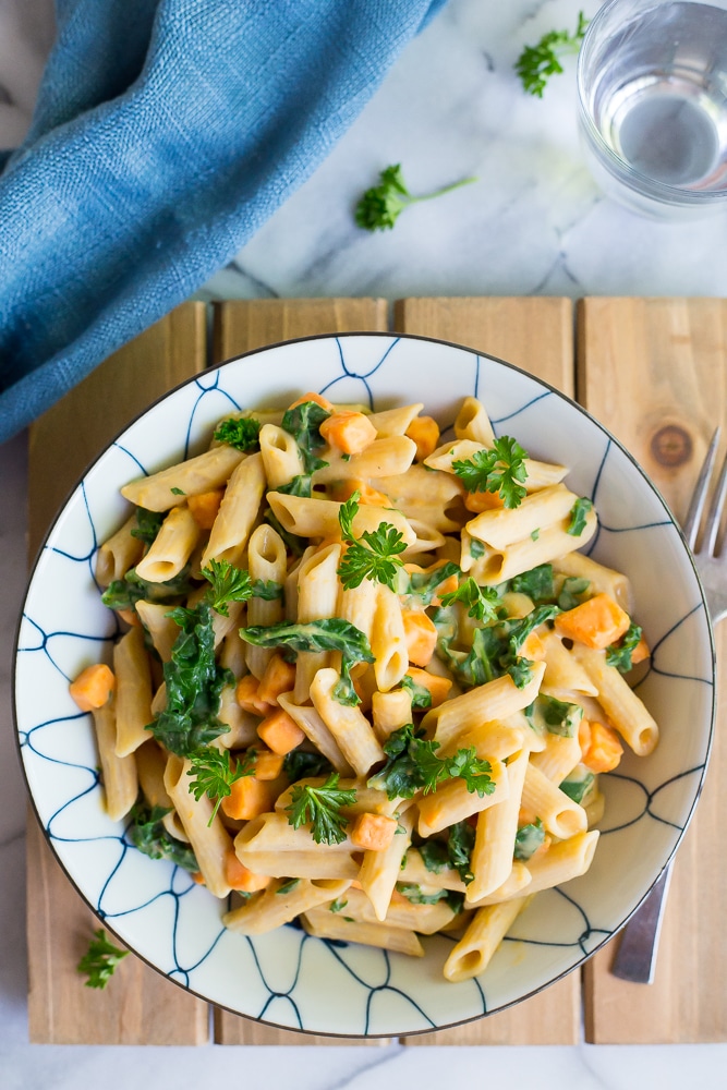 This delicious Creamy White Bean Pasta with Sweet Potato and Kale is so easy to make and comes together in only 30 minutes! It's the perfect vegetarian dish for a weeknight dinner! Gluten free and vegan too!