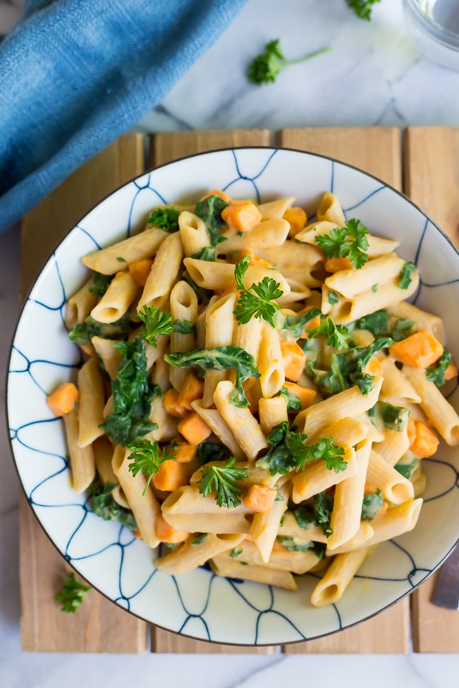 This delicious Creamy White Bean Pasta with Sweet Potato and Kale is so easy to make and comes together in only 30 minutes! It's the perfect vegetarian dish for a weeknight dinner! Gluten free and vegan too!