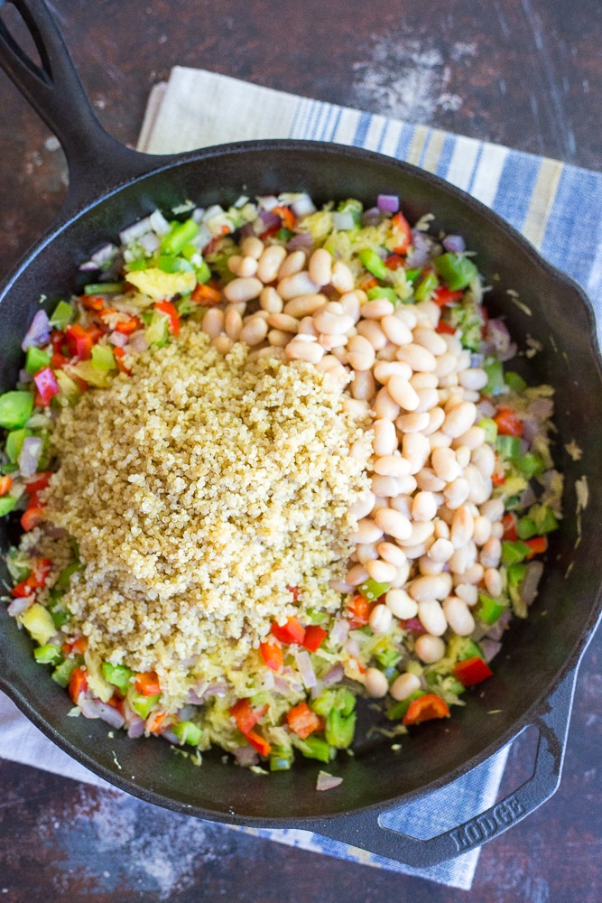 This Spaghetti Squash Pizza Bake with Quinoa & White Beans is packed with protein and delicious flavor! Great for a weeknight dinner or a holiday main course! Gluten free and vegan too!