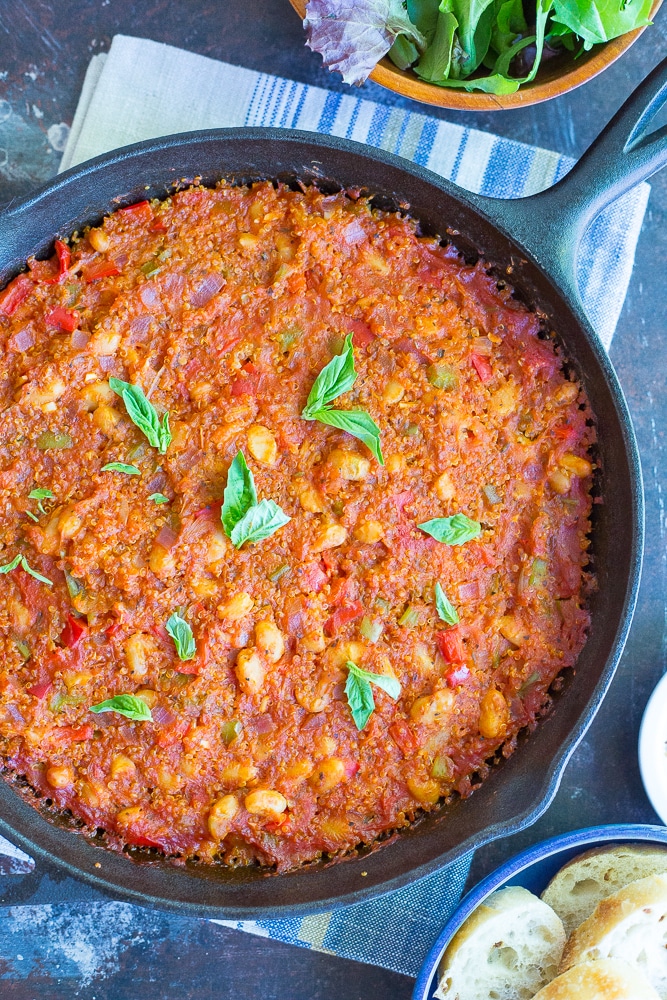This Spaghetti Squash Pizza Bake with Quinoa & White Beans is packed with protein and delicious flavor! Great for a weeknight dinner or a holiday main course! Gluten free and vegan too!