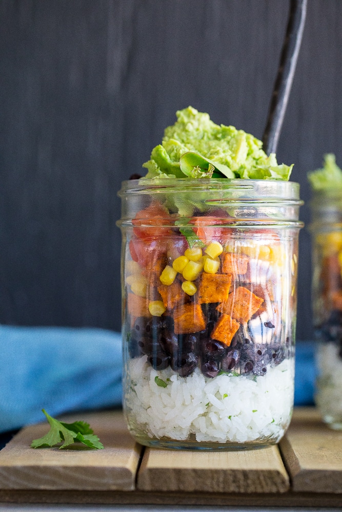 These Vegetarian Mason Jar Burrito Bowls can be made ahead of time and eaten for lunches or dinner! Easy to assemble and lots of great flavors! Vegan and gluten free.