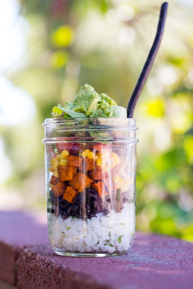 These Vegetarian Mason Jar Burrito Bowls can be made ahead of time and eaten for lunches or dinner! Easy to assemble and lots of great flavors! Vegan and gluten free.