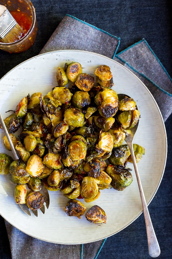 These Sweet Chili Roasted Brussels Sprouts are the perfect way to mix up your traditional brussels sprouts! They're the perfect side dish! Vegan and gluten free