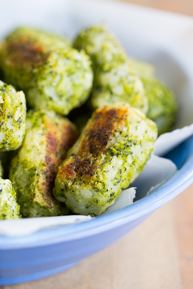 These 4 Ingredient Broccoli Tater Tots are packed with tons of broccoli and baked in the oven making them a really healthy side dish or snack! A perfect way to get some extra veggies into your life! Vegan and gluten free!