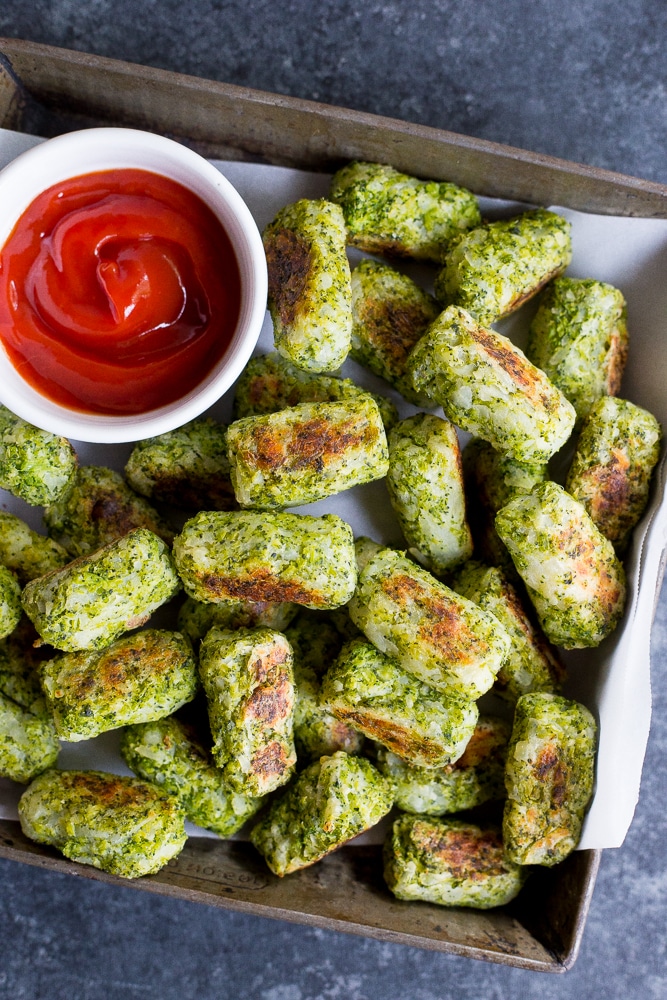 These 4 Ingredient Broccoli Tater Tots are packed with tons of broccoli and baked in the oven making them a really healthy side dish or snack! A perfect way to get some extra veggies into your life! Vegan and gluten free!
