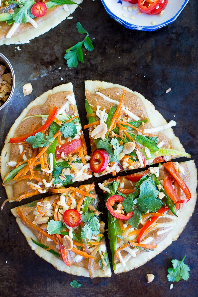 These Easy Thai Vegetable Pita Pizzas only take 30 minutes to make and are great for a delicious vegetarian weeknight dinner! Gluten free and vegan option too!