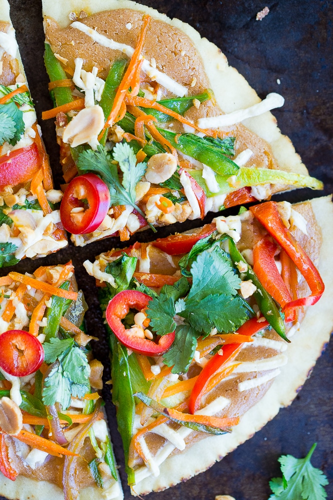 These Easy Thai Vegetable Pita Pizzas only take 30 minutes to make and are great for a delicious vegetarian weeknight dinner! Gluten free and vegan option too!