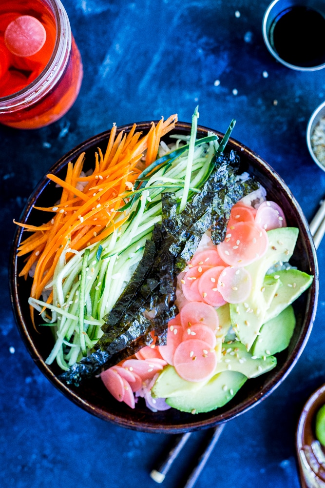 These Veggie Sushi Bowls with Quick Pickled Radishes come together really quickly for a delicious and healthy meal! Eat them for dinner or make them as a lunch meal prep idea! Vegan and gluten free!