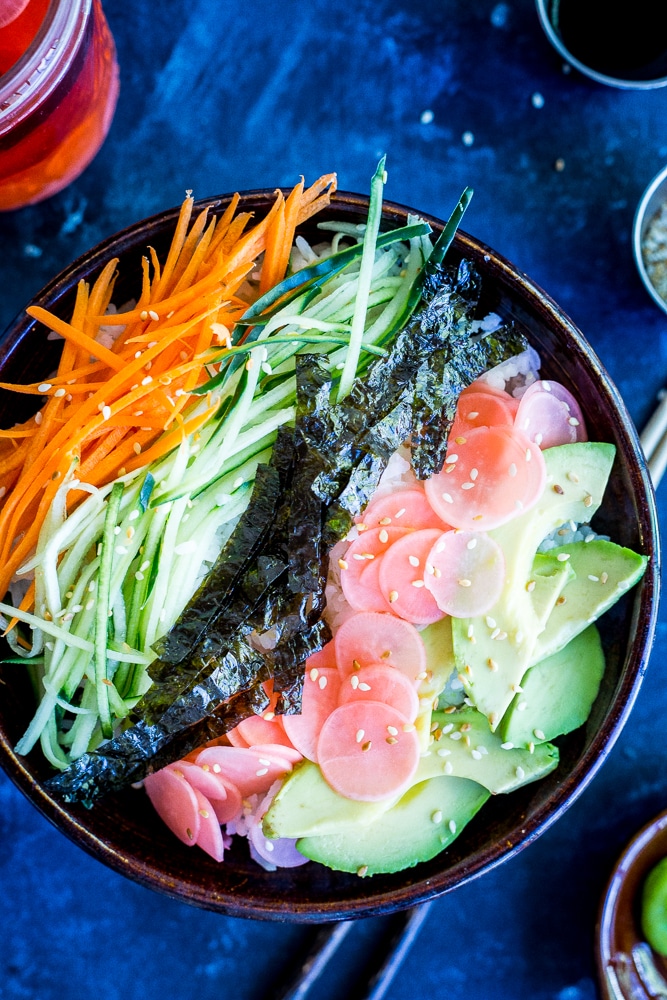 These Veggie Sushi Bowls with Quick Pickled Radishes come together really quickly for a delicious and healthy meal! Eat them for dinner or make them as a lunch meal prep idea! Vegan and gluten free!