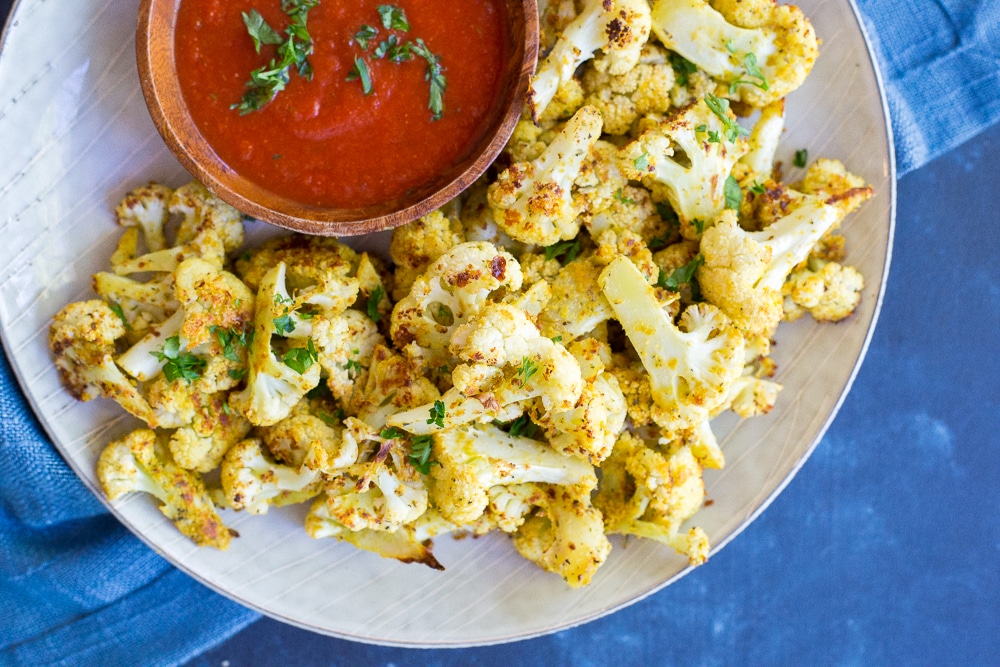 Baked Cauliflower Pizza Bites- These would be a great healthy afternoon snack or the perfect side dish for dinner! Make them as a healthier option to go with your next pizza night! Gluten free and vegan!