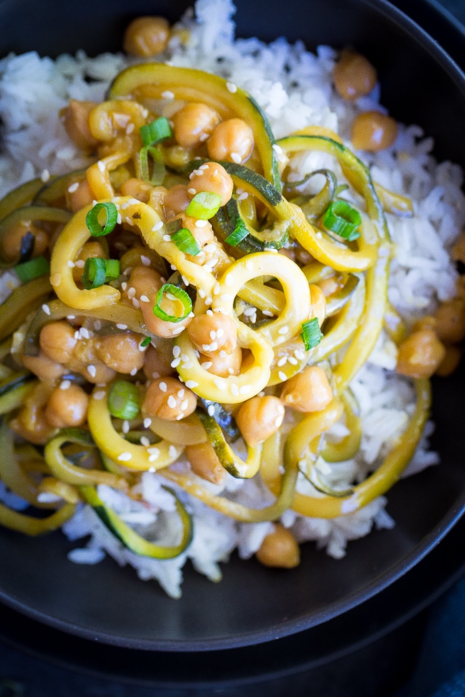  These 30 Minute Orange Ginger Zucchini Noodle Chickpea Bowls are great for a quick and easy vegetarian (and vegan) weeknight dinner! They're also perfect for a healthy make ahead lunch bowl! Gluten free too!