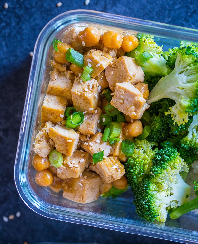 Closeup of Orange Tofu Chickpea Bowls in a meal prep container