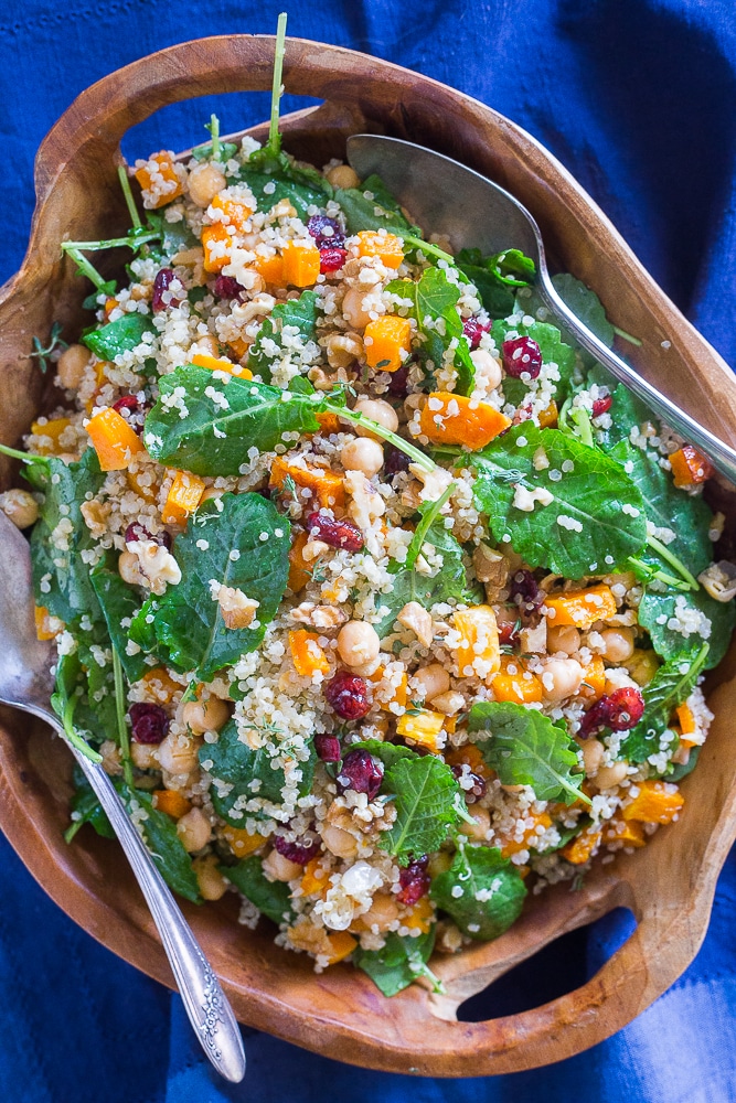Winter Quinoa Salad in a large wooden bowl with two spoons