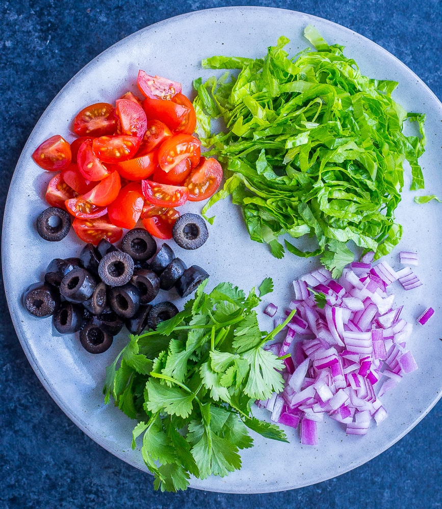 Taco Pizza Bagel toppings on a plate