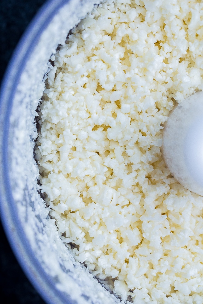 Close up of cauliflower rice in the food processor