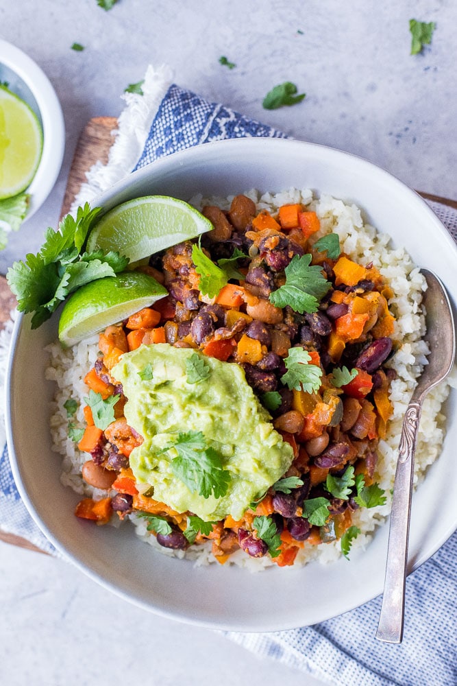 Bowl of Chili Beans with guacamole and cilantro