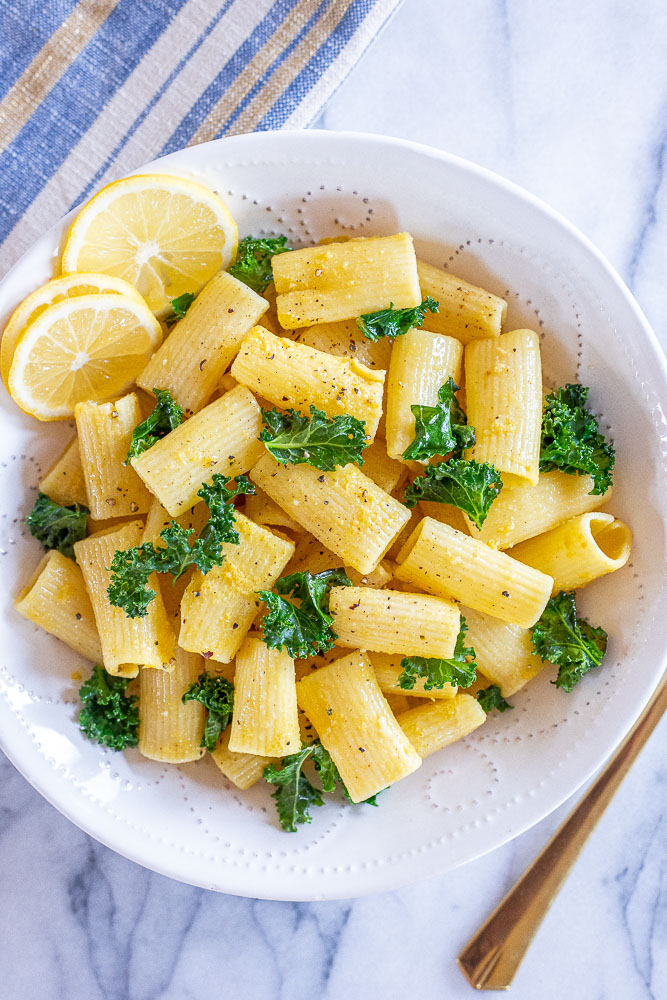 a bowl of lemon garlic pasta with kale
