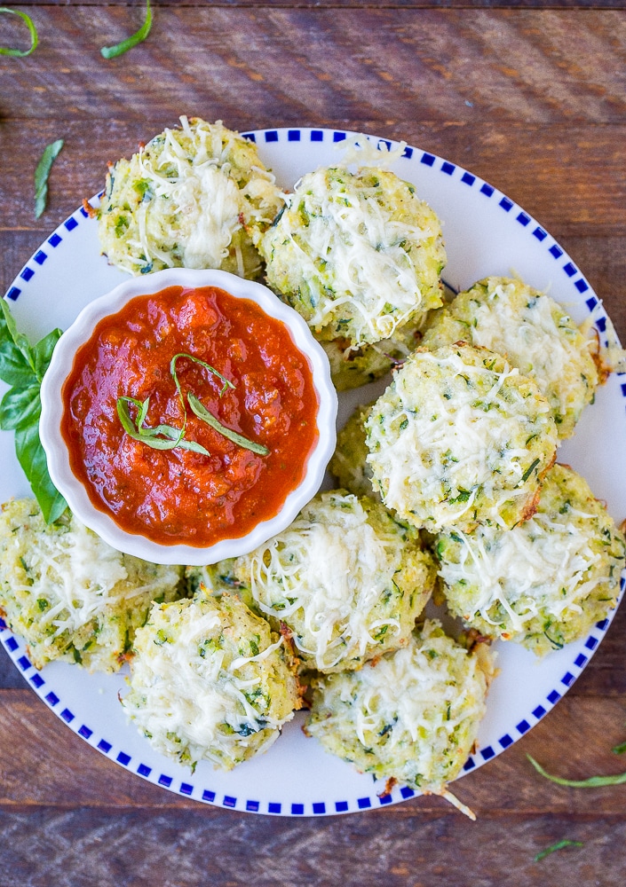 Zucchini Pizza Bites on a plate with marinara sauce