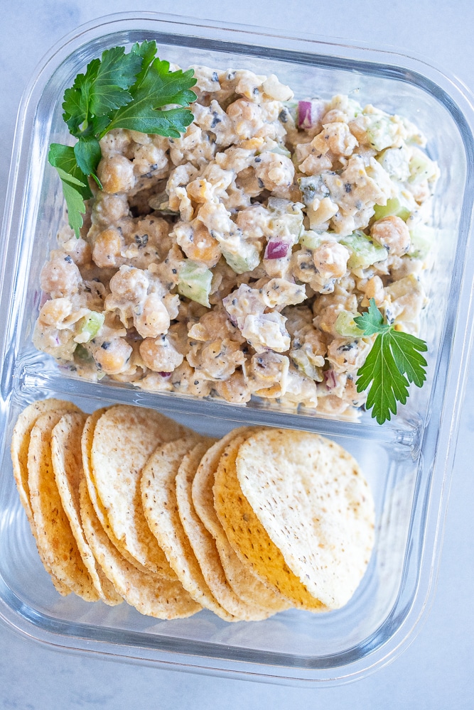 vegan tuna salad in a meal prep container with chips
