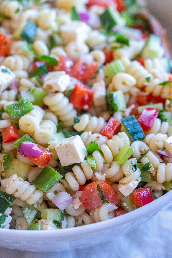 close up of vegetable pasta salad with feta cheese