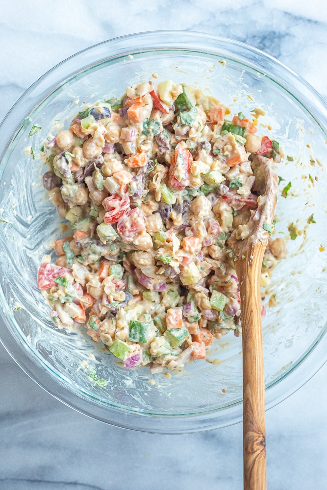 lemon tahini chickpea salad recipe mixed up in a bowl