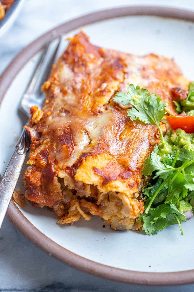 close up of zucchini enchiladas on a plate
