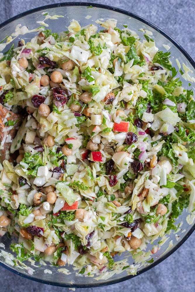cabbage and kale salad mixed together in a bowl