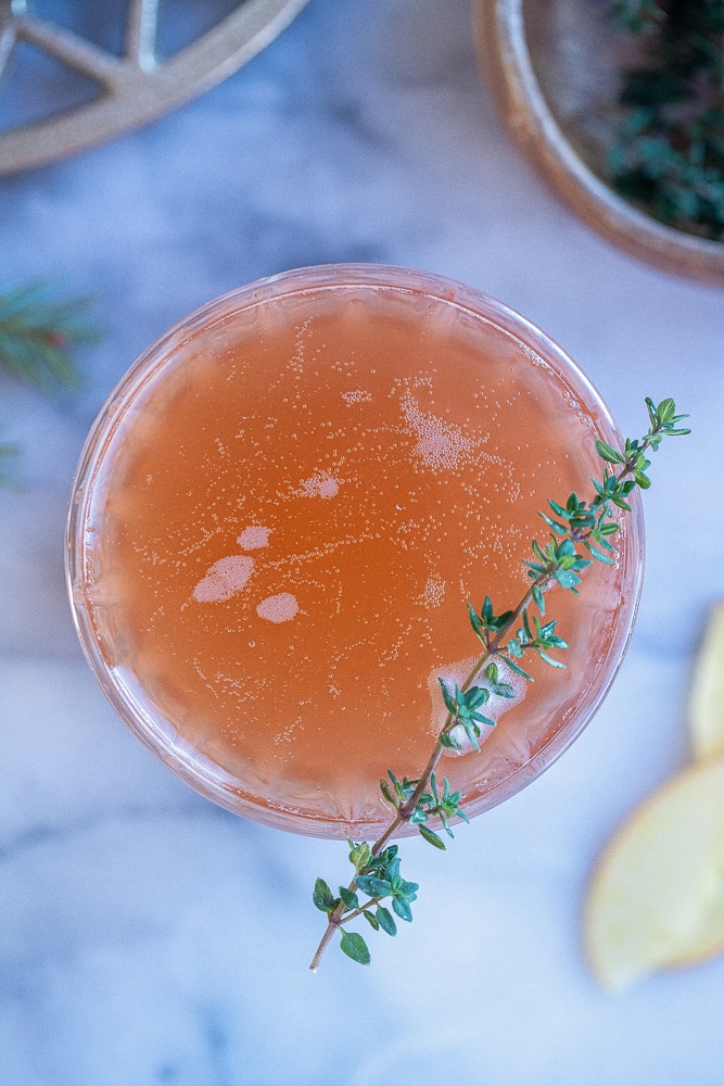 close up of a glass of apple cranberry mimosas