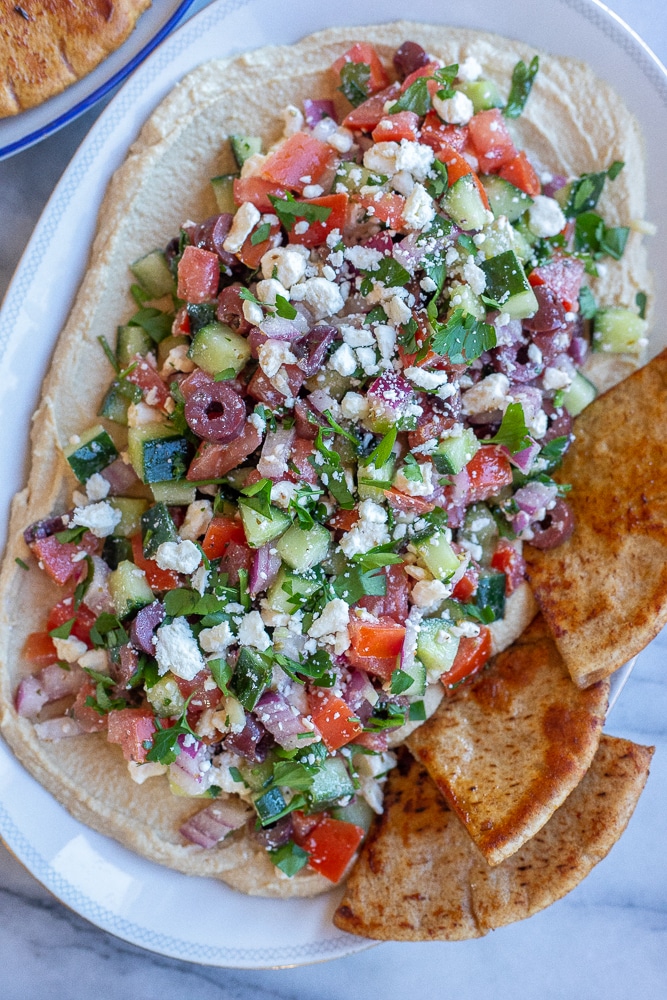 Greek Hummus Dip on a platter with pita bread