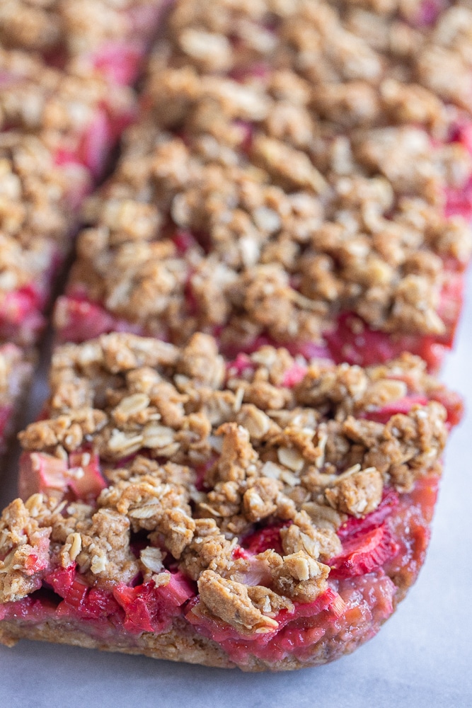 close up of a strawberry rhubarb crumble bar