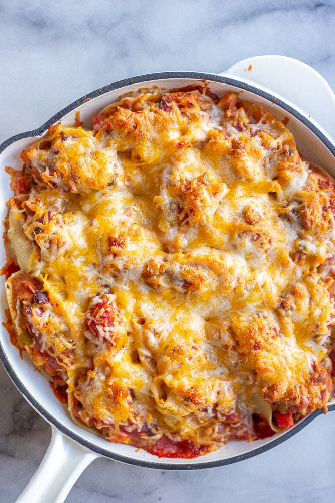 chili cheese stuffed shells in a baking dish