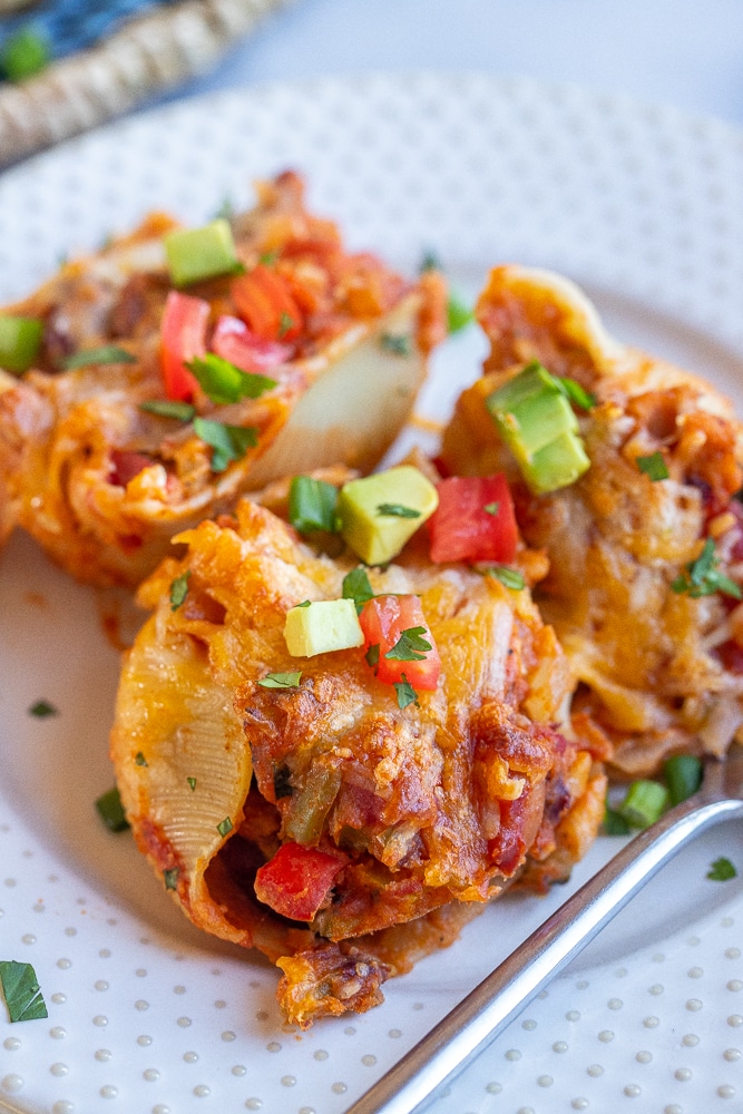 close up of a chili cheese stuffed shell on a plate