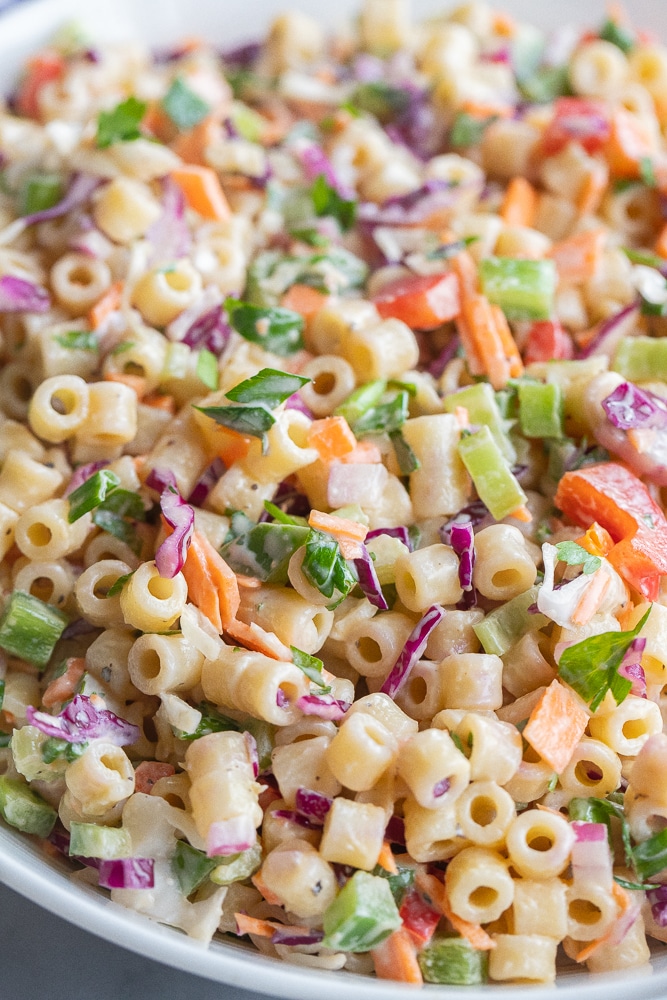 close up of a bowl of creamy macaroni coleslaw salad