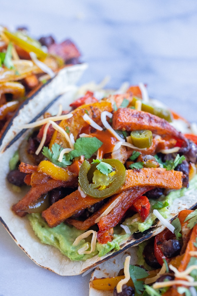 close up of a sweet potato black bean fajita with jalapeños