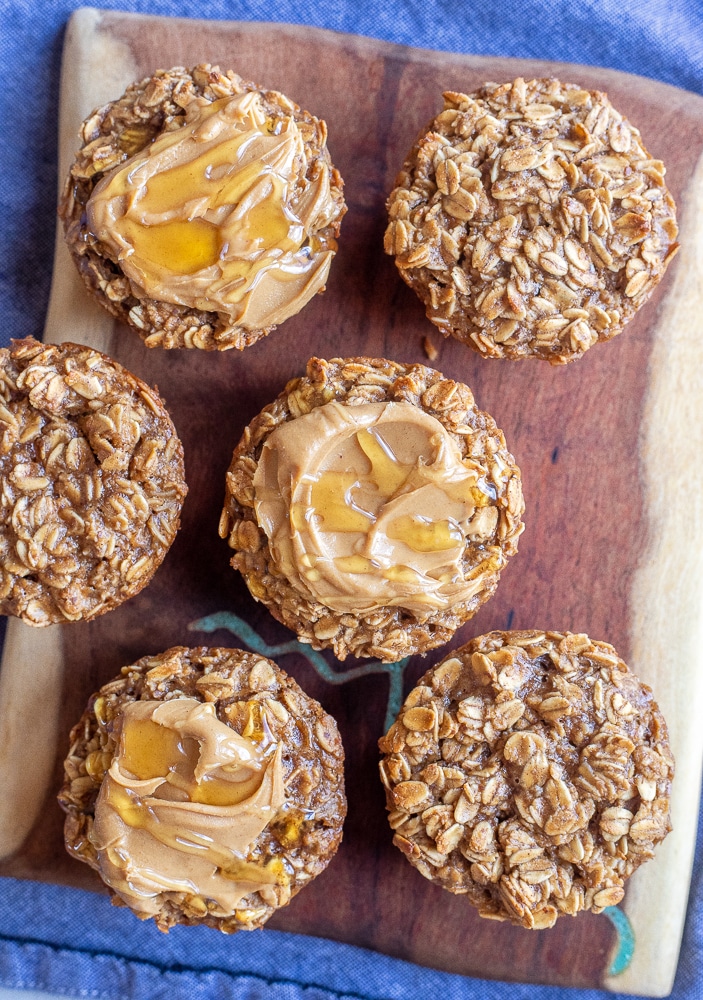 a board full of peanut butter honey oatmeal muffins