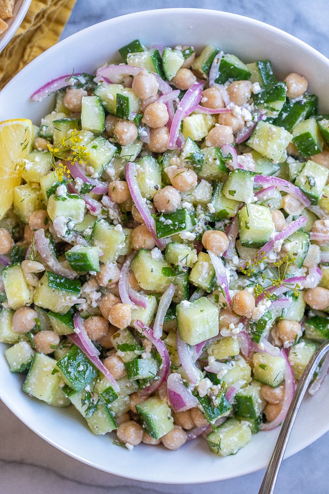 Close up of lemon feta cucumber salad in a serving bowl