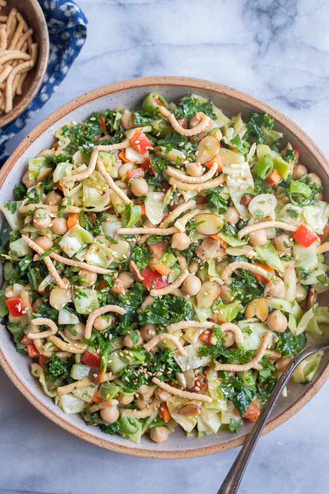 large bowl of crunchy Chinese cabbage salad with chow mien noodles and chickpeas