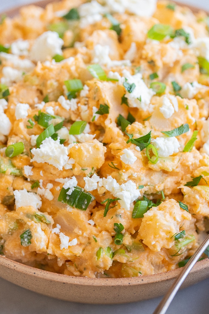 close up of a bowl of buffalo potato salad
