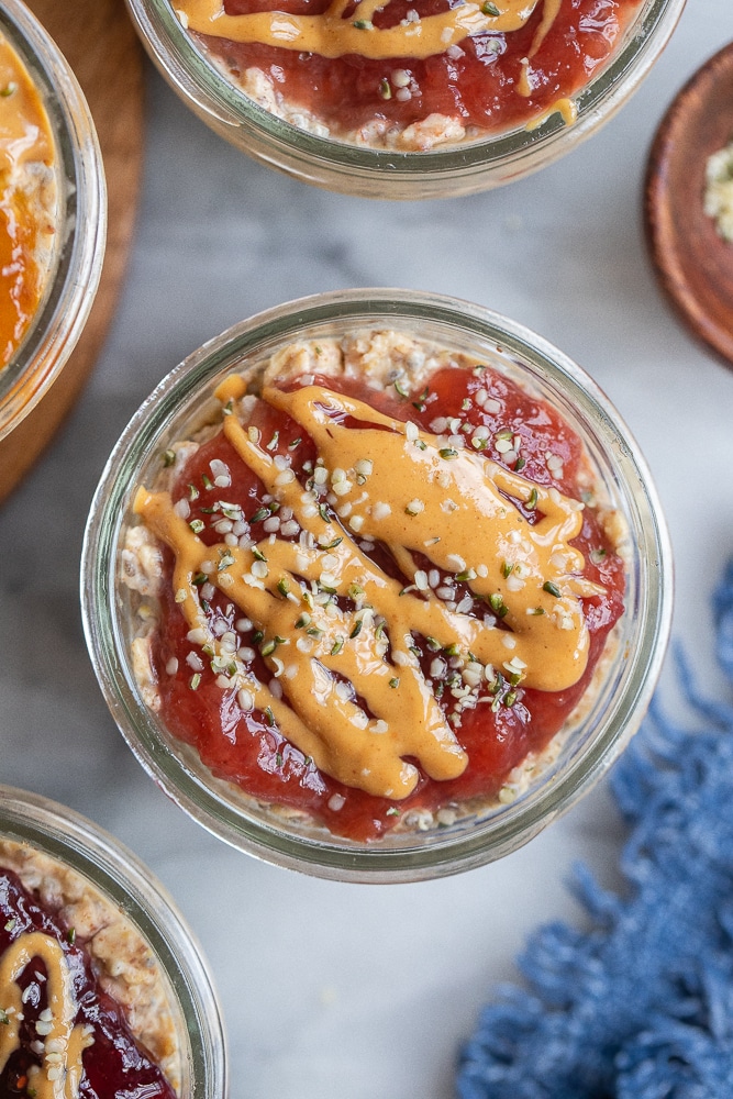 peanut butter and jelly overnight oats in a glass jar