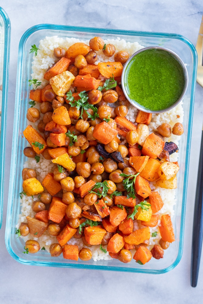 close up of a roasted carrot couscous bowl with green tahini dressing